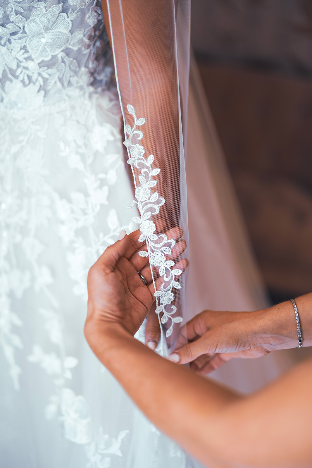 Photo of wedding dress flower pattern detail.